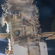 Cosmonauts Oleg Artemyev and Denis Matveev of Roscosmos are pictured attached to the Nauka multipurpose laboratory module during a spacewalk on April 28, 2022, to activate the European robotic arm on the International Space Station.